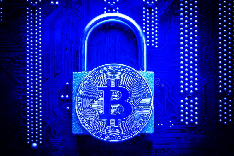 bitcoin-padlock-computer-motherboard-crypto-currency-internet-data-privacy-information-security-concept-blue-toned-image-105736554